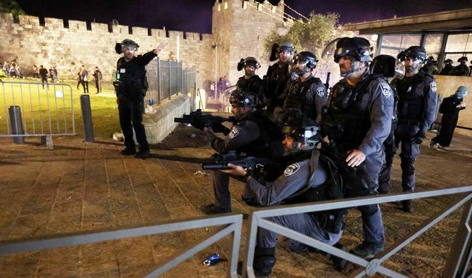 Israeli police take position during clashes with Palestinians on Laylat al-Qadr during the holy month of Ramadan, at Jerusalem's Old City, May 8, 2021. (REUTERS)