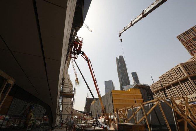 Work on the exterior of the King Abdullah Financial District station of the Riyadh Metro in full swing on April 1, 2021. (AFP)