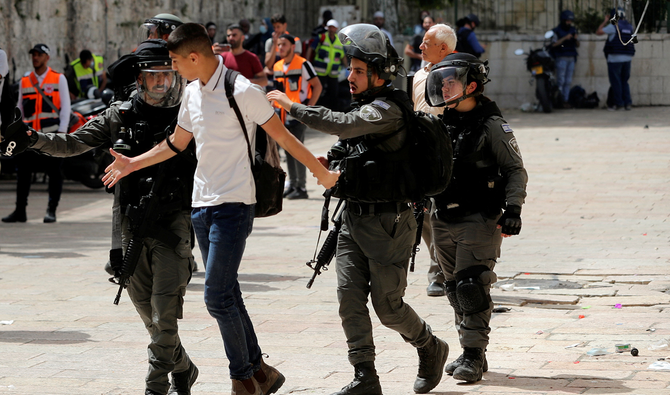 Israeli police detain a Palestinian during clashes at the compound that houses Al-Aqsa Mosque, known to Muslims as Noble Sanctuary and to Jews as Temple Mount, in Jerusalem's Old City, May 10, 2021. (Reuters)