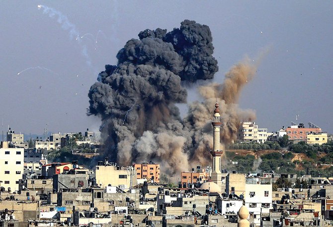 Smoke billows after Tuesday’s Israeli air strikes in Gaza. The conflict spread following a violent Israeli crackdown on worshippers in Al-Aqsa Mosque. (AFP)