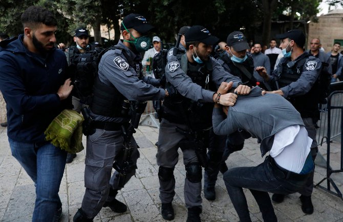 Israeli security forces detain a Palestinian who tried to break through a security barrier to enter the the closed Aqsa mosque complex in Jerusalem on May 24, 2020. (AFP file photo)