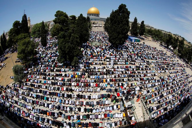 Palestinian worshippers pray outside the Dome of the Rock in Jerusalem's Al-Aqsa Mosque compound on April 30, 2021. (Photo by AHMAD GHARABLI / AFP)