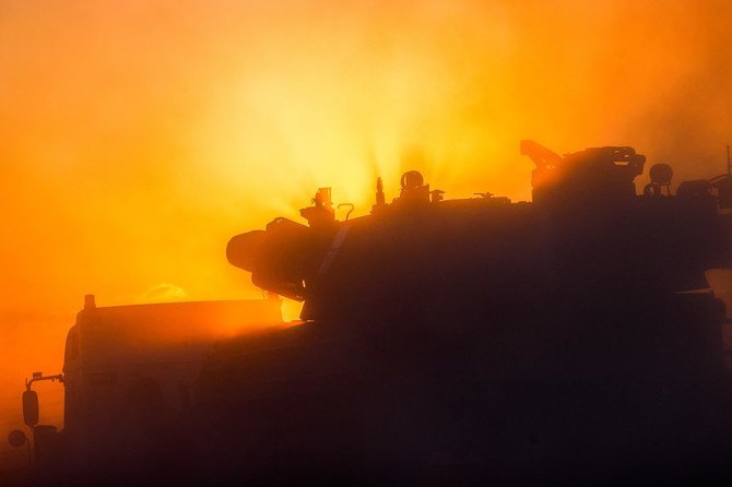 An explosion lights the sky following an Israeli air strike on Beit Lahia in the northern Gaza Strip on May 14, 2021. (File/AFP)