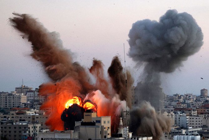 Smoke billows after an Israeli airstrike on Gaza City targeted the Ansar compound, linked to the Hamas movement, in the Gaza Strip on May 14, 2021. (AFP)
