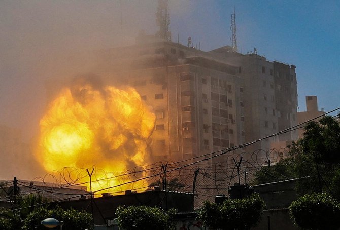 A ball of fire erupts from the Jala Tower as it is destroyed in an Israeli airstrike in Gaza City on May 15, 2021. (AFP)