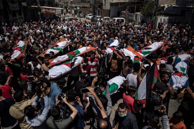 Palestinians attend the funeral of two women and eight children of the Abu Hatab family in Gaza City, who were killed by an Israeli air strike, on May 15, 2021. (AP Photo/Khalil Hamra)