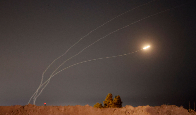 This picture taken from the southern Israeli city of Sderot shows rockets fired from the Gaza Strip being intercepted by the Israeli Iron Dome missile defence system, on May 16, 2021. (AFP)