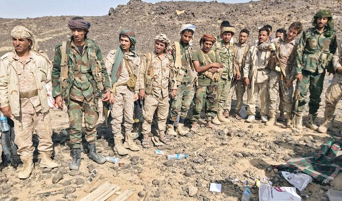 Fighters loyal to Yemen’s government man a position near the frontline facing Iran-backed Houthi rebels in the country’s northeastern province of Marib. (File/AFP)