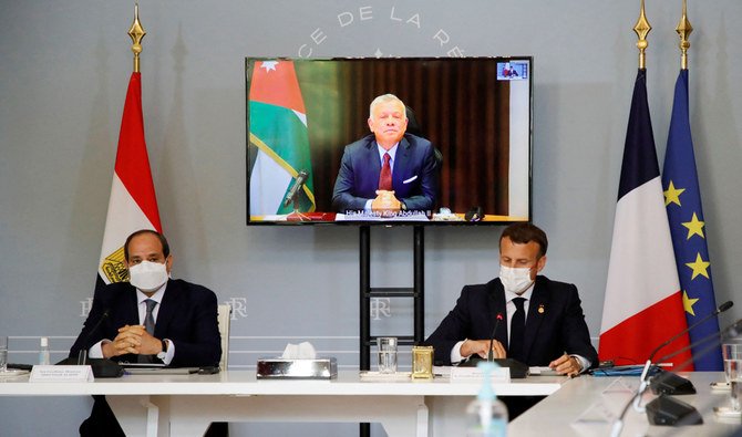 French President Emanuel Macron, right, and Egyptian President Abdel Fattah el-Sisi attend video conference with Jordan's King Abdullah II, on screen, to work on a concrete proposal for a ceasefire between Israel and the Palestinians at the Elysee Palace in Paris, May 18, 2021. (AFP)