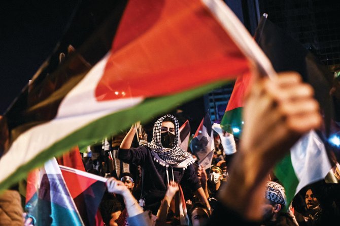 Demonstrators protest in Istanbul, Turkey, against Israel’s Gaza campaign. Similar rallies have taken place around the world. (AFP file photo)