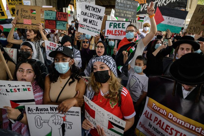 Demonstrators march in a 'Rally for Palestine' in the Queens borough of New York on May 22, 2021. (Photo by Ed Jones / AFP)