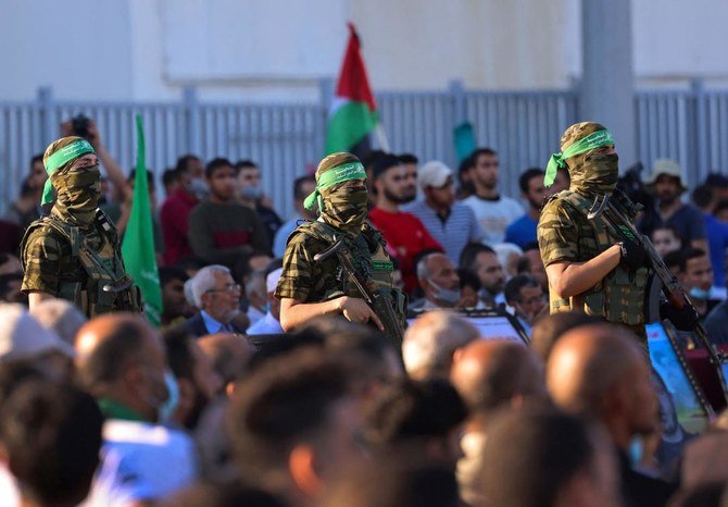 Al-Qassam Brigades in a rally at Gaza City on Monday. A cease-fire was reached after 11 days of deadly violence between Hamas and Israel that wants aid to rebuild Gaza to bypass Hamas. (AFP)