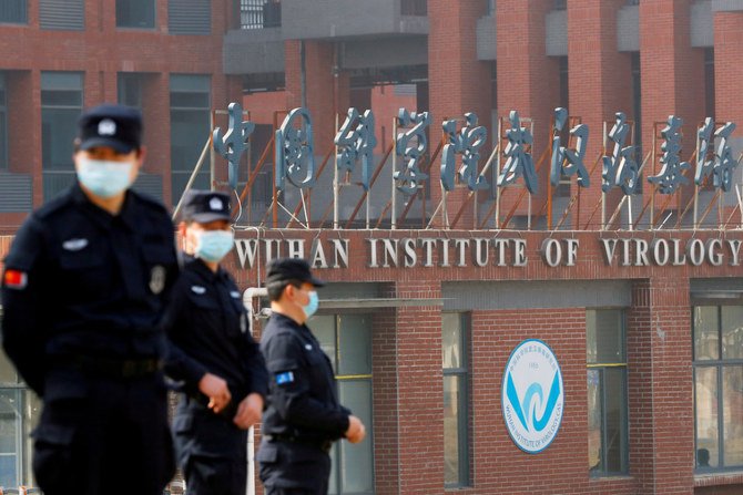 Security personnel keep watch outside the Wuhan Institute of Virology during a visit by a World Health Organization team investigating the origins of COVID-19 in Wuhan, China on Feb. 3, 2021. (Reuters file)