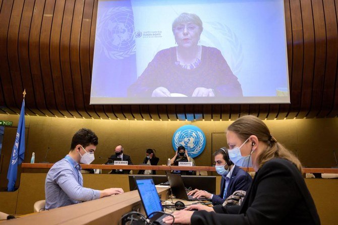 UN High Commissioner for Human Rights Michelle Bachelet on a giant screen delivering her speech at the opening of a UN Human Rights Council emergency meeting on occupied Palestinian territory and East Jerusalem, in Geneva on May 27, 2021. (AFP)