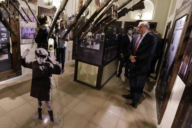 Israeli's Ambassador to the UAE Eitan Naeh visits an exibition commemorating the Jewish Holocaust. (AFP)