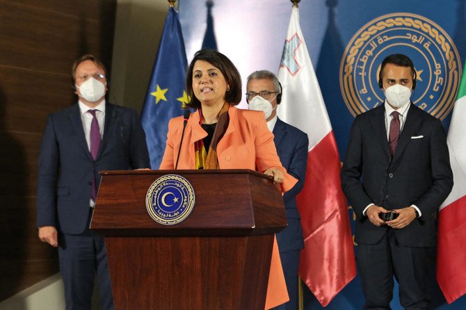 Najla Al-Mangoush speaks during a conference with Oliver Varhelyi (back-L), Evarist Bartolo ( back-C), and Luigi Di Maio (back-R) in Tripoli on May 28, 2021. (AFP)