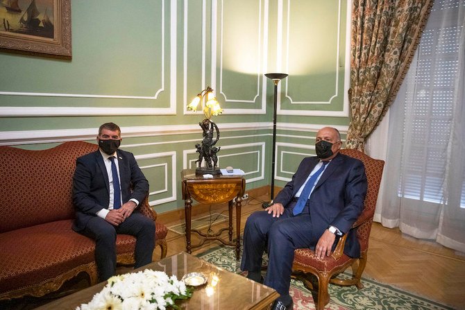 Egyptian Foreign Minister Sameh Shoukry (R) meets with Israeli Foreign Minister Gabi Ashkenazi at the Tahrir Palace in Cairo, Egypt, Sunday, May 30, 2021. (AP)