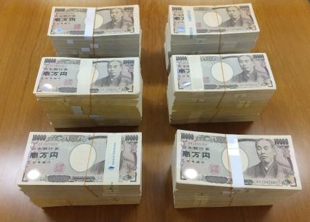 This handout photo taken on May 17, 2021 and received from Yokosuka City on May 18 shows 60 million yen (550,850 USD) in cash donated by an elderly man anonymously to Yokosuka City, Kanagawa prefecture. (AFP)