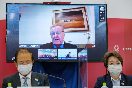 Tokyo 2020 CEO Toshiro Muto, Tokyo 2020 President Seiko Hashimoto and IOC Coordination Commission Chairman John Coates remotely on-screen attend an International Olympic Committee (IOC) and Tokyo 2020 Olympic news conference after a three-day IOC Coordination Commission meeting, in Tokyo, Japan, May 21, 2021. (Reuters)