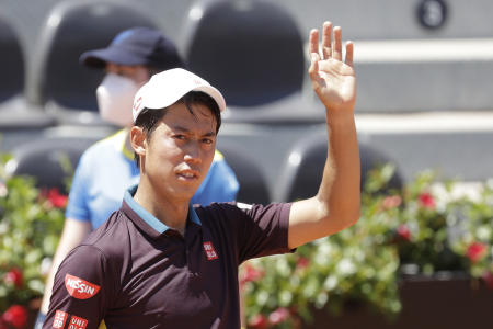 Japan's Kei Nishikori waves after winning his match against Italy's Fabio Fognini at the Italian Open tennis tournament, in Rome, Monday, May 10, 2021. Nishikori won 6-3, 6-4. (AP)