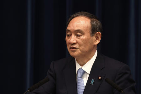 Japan's Prime Minister Yoshihide Suga speaks during a press conference at the prime minister's official residence Friday, May 28, 2021, in Tokyo. Japan extended a coronavirus state of emergency in Tokyo and other areas for 20 more days on Friday. (AP)