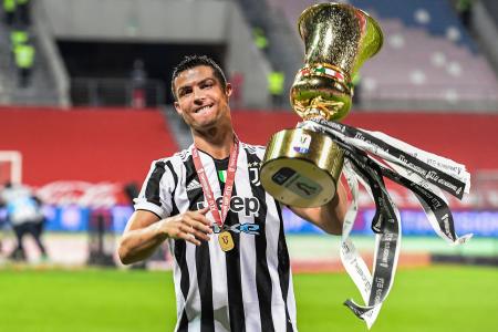 In this file photo taken on May 19, 2021 Juventus' Portuguese forward Cristiano Ronaldo holds the cup after Juventus won the final of the Italian Cup. (AFP)