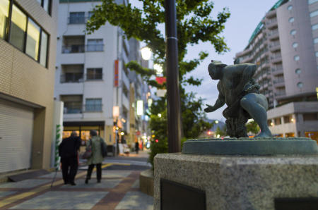 A statue of a sumo wrestler near the Ryogoku Kokugikan sporting arena, mainly used for sumo wrestling tournaments, in Tokyo on Friday, April 30, 2021. (AP)