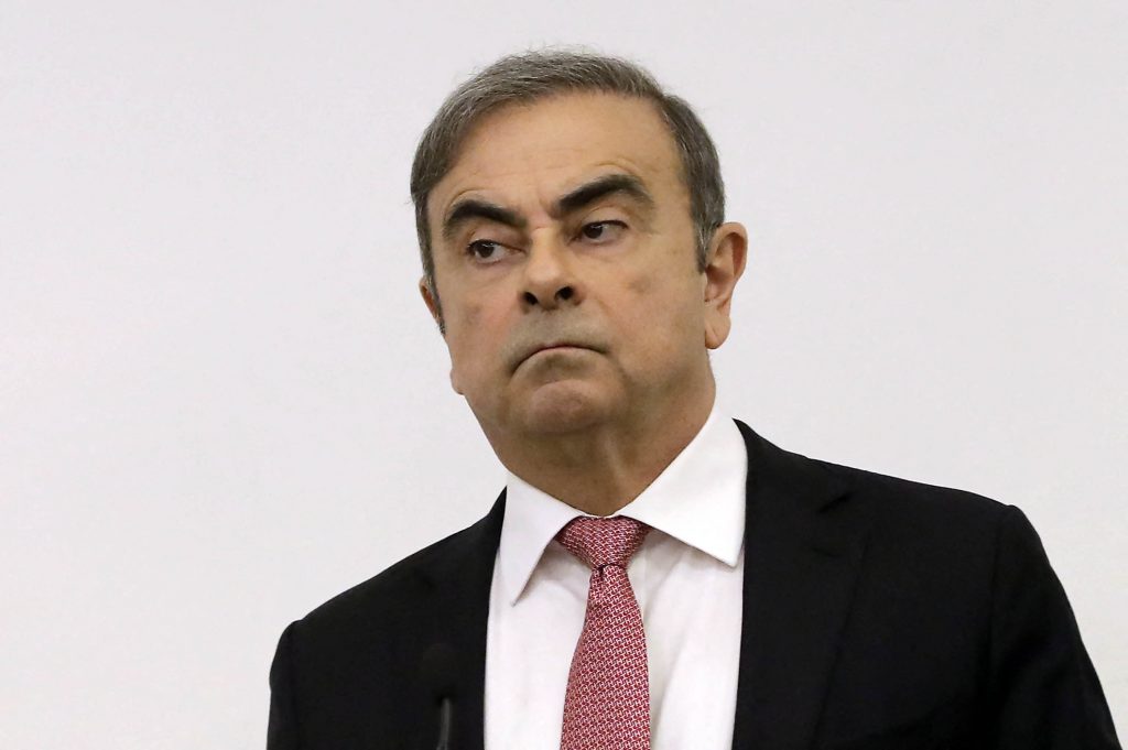 Former Renault-Nissan boss Carlos Ghosn looks on before addressing a large crowd of journalists on his reasons for dodging trial in Japan, where he is accused of financial misconduct, at the Lebanese Press Syndicate in Beirut on January 8, 2020. (AFP)