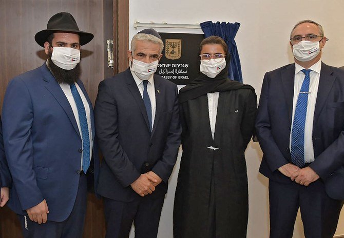 (L to R) Rabbi Levi Duchman, Israeli FM Yair Lapid, Emirati Minister of Culture and Knowledge Development Noura Al-Kaabi, and Israeli Foreign Ministry's director general, Eitan Naa during the inauguration of the Israeli Embassy in Abu Dhabi. (AFP)