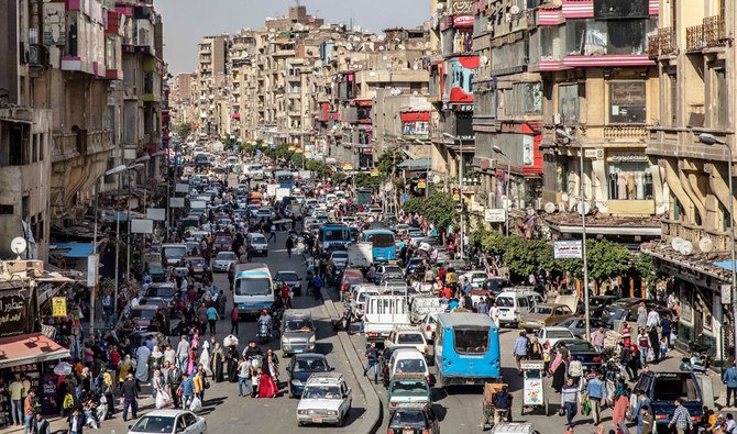 In this Tuesday, April 14, 2020 file photo, people crowd a street a few hours ahead of curfew in Cairo, Egypt. (AP)