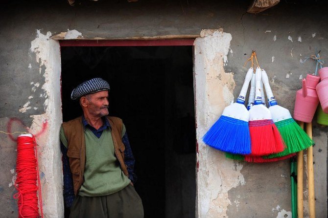 A Kurdish refugee stands in front of his shop at the Mahkmour refugees camp in Arbil, northern Iraq, on Oct. 29, 2009. (File/AFP)