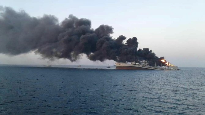 Smoke rises from Iran navy's largest ship in Jask port. (Reuters)