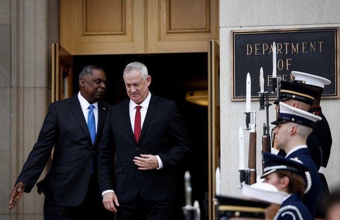 US Defense Secretary Lloyd Austin greets Israel's Defense Minister Benny Gantz during an enhanced honor cordon for Gantz at the Pentagon in Arlington, Virginia, on June 3, 2021. (REUTERS/Carlos Barria)