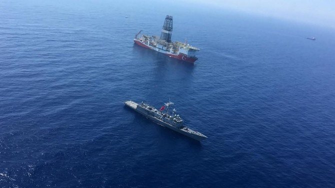 A Turkish Navy warship patrols next to Turkey's drilling ship “Fatih”. (File/AFP)