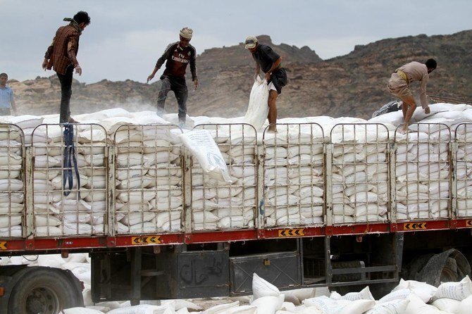 International aid deliveries to Yemen are frequently disrupted by Houthi militia. Above, spoiled World Food Program (WFP) wheat flour is disposed of, outskirts of Sanaa, Yemen, Aug. 28, 2019. (Reuters)