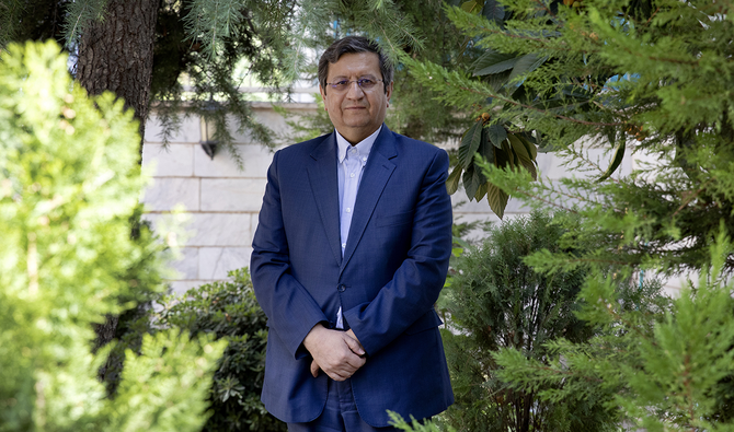 Former Iranian Central Bank chief Abdolnasser Hemmati, a candidate in Iran's upcoming presidential election, poses for a photo at his office in Tehran, Iran, Wednesday, June 9, 2021. (AP)