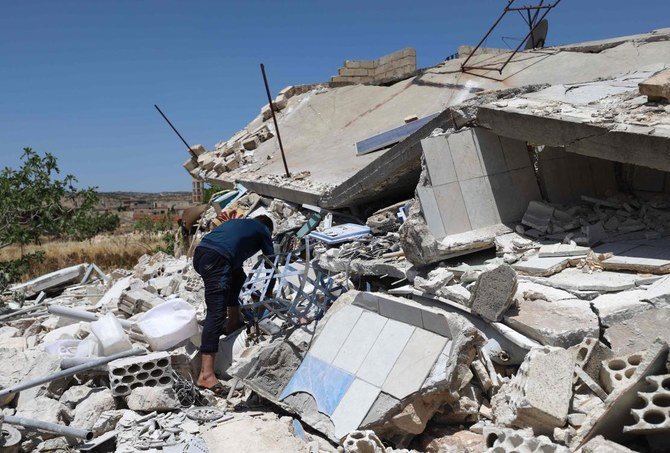 A man looks through the rubble of a destroyed house in the village of Iblin in the Jabal al-Zawiya region in Syria's rebel-held northwestern Idlib province on June 10, 2021. (AFP)