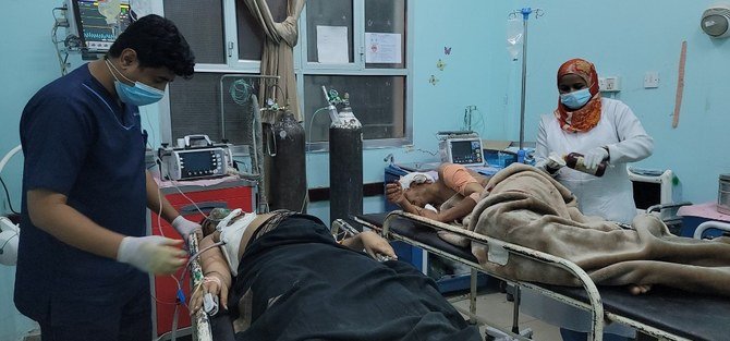 Civilians wounded in a Houthi missile strike in Marib on Thursday receive treatment at local hospitals. (AN Photo)