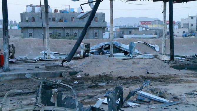 This picture taken on June 5, 2021 shows a view of a destroyed vehicle at the scene of a Houthi missile strike at a petrol station in Yemen’s city of Marib. (AFP)