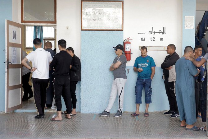 Voters queue to cast their ballots outside a polling station in Algiers, Algeria, on June 12, 2021. (AP Photo/Toufik Doudou)