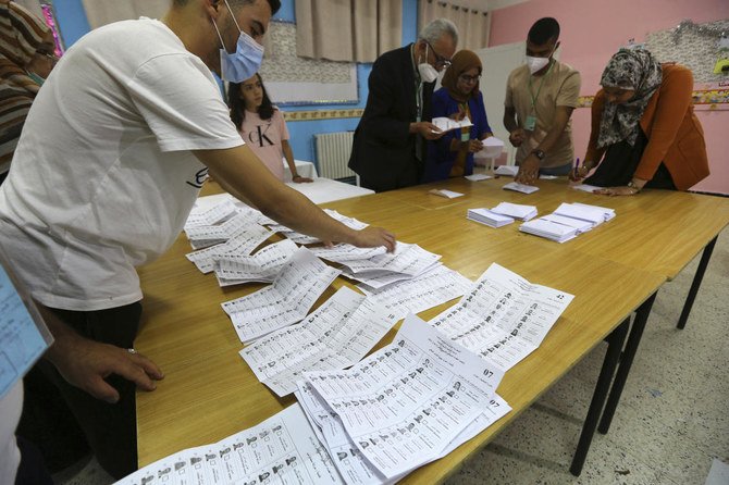 Election officials count ballots after the closing of stations, in Algiers, Algeria, Saturday, June 12, 2021. (AP)