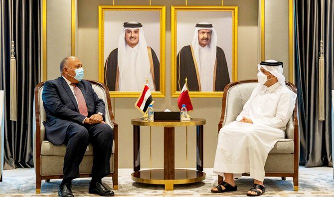 Qatar's Deputy Prime Minister and Minister of State for Defense Affairs Khalid bin Mohamed al-Attiyah (R) meeting with Egypt's Foreign Minister Sameh Shoukry in Doha on June 14, 2021. (AFP)