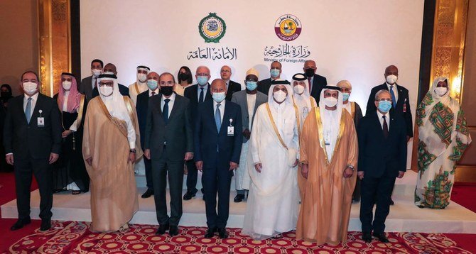 Arab Ministers of Foreign Affairs pose for a group photo ahead of a consultative meeting in Doha on Tuesday. (AFP)