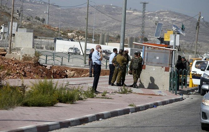 Israeli security forces gather at the site where a Palestinian woman attempted to stab an Israeli border police with a knife before being shot dead. (File/AFP)