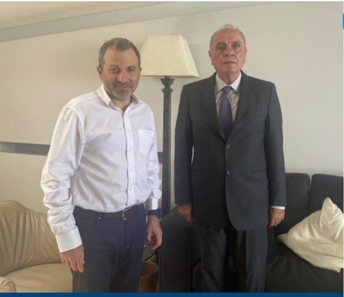 MP Gebran Bassil with the father of Yasmine Masri, who told Arab News the lawmaker ‘coerced’ her dad to apologize. Masri defiantly vows to ‘never shut up’. (Twitter)