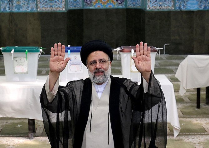 In this file photo taken on June 18, 2021 Iranian ultraconservative cleric and presidential candidate Ebrahim Raisi waves after casting his ballot for presidential election, in the capital Tehran. (AFP)