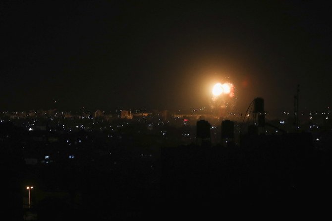 Smoke and flames are seen after an Israeli air strike in the northern Gaza Strip. (Reuters)