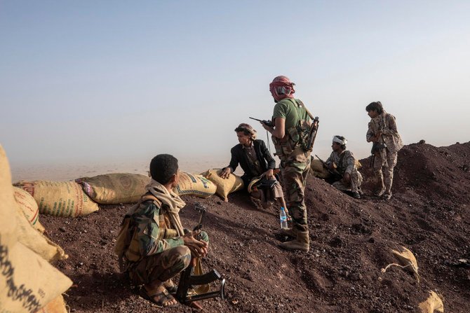 Yemeni fighters backed by the Saudi-led coalition are seen on the Kassara frontline near Marib on June 20, 2021. (AP Photo/Nariman El-Mofty)