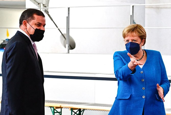 German Chancellor Angela Merkel welcomes Libyan Prime Minister Abdul Hamid Dbeibah in Berlin on June 23, 2021, on the sidelines of a new round of Libya peace talks. (AFP / Tobias Schwarz)