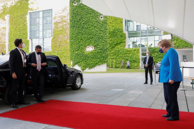 German Chancellor Angela Merkel welcomes Libyan Prime Minister Abdulhamid Dbeibeh at the sidelines of the second Libya summit in Berlin on June 23, 2021. (REUTERS/Michele Tantussi)